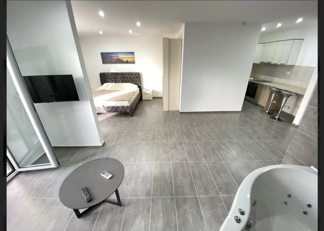 One-bedroom apartment with a jacuzzi in the living room, located in a modern building with an elevator